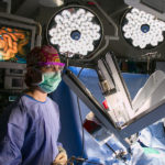 Doctor standing near medical equipment